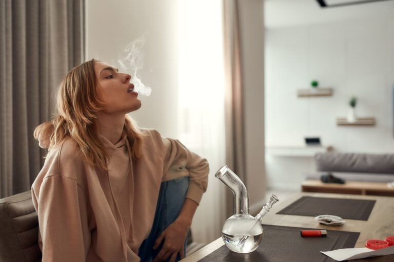 Girl Smoking Glass Bong In Comfort