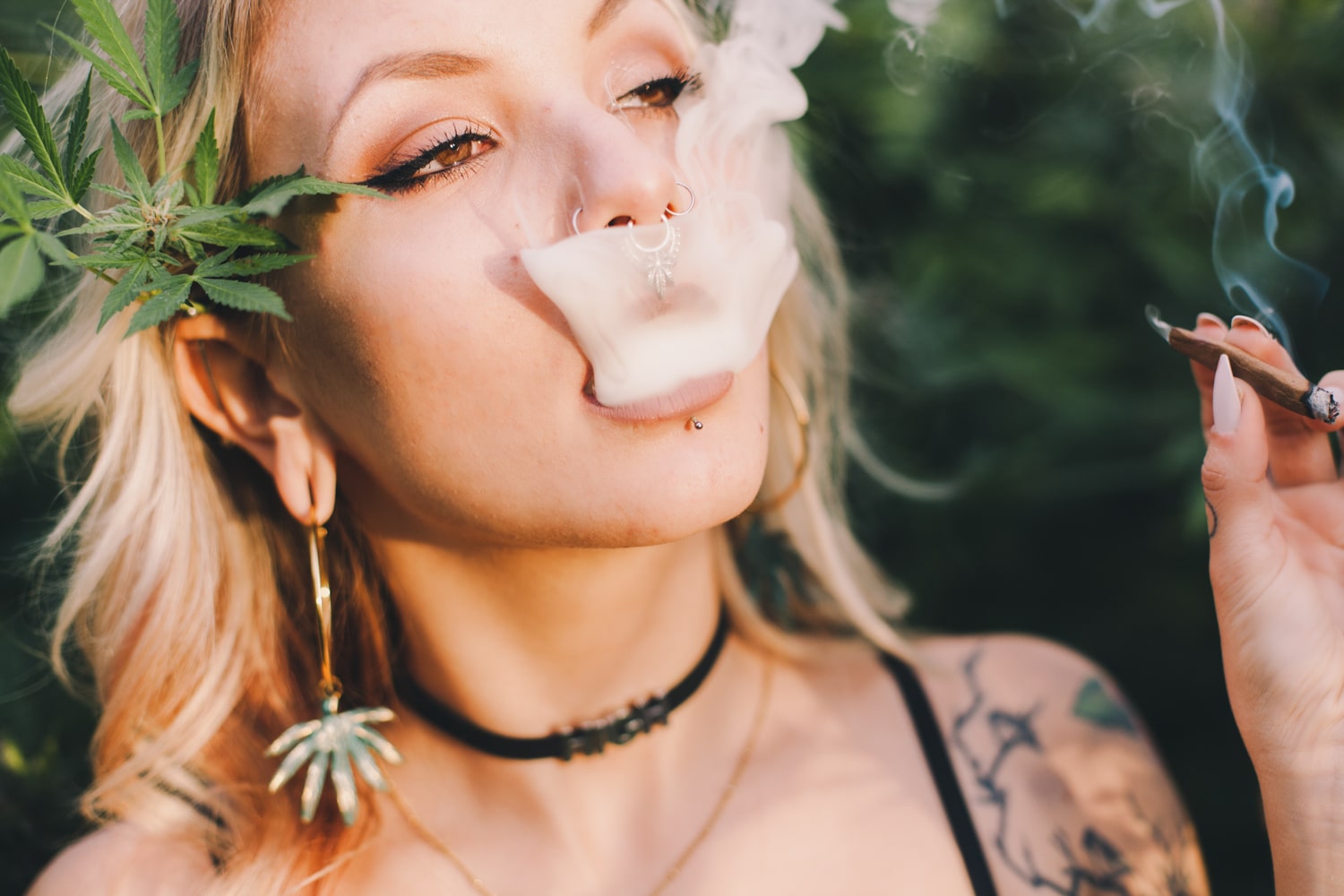 Attractive woman enjoying cannabis joint